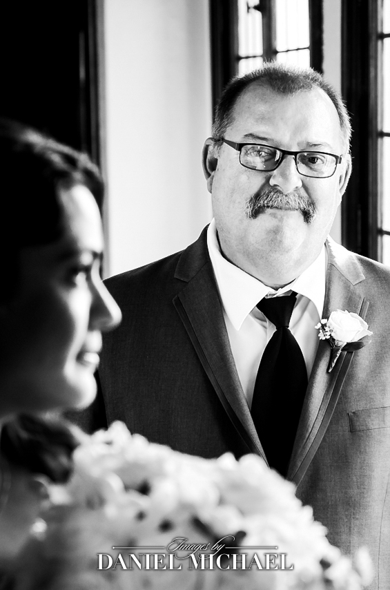 Memorable film wedding photo of dad admiring bride